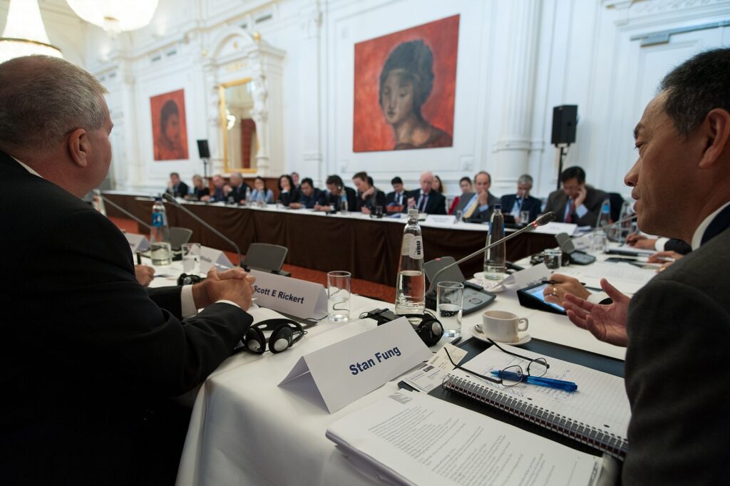 Executives discussing strategy around a conference table