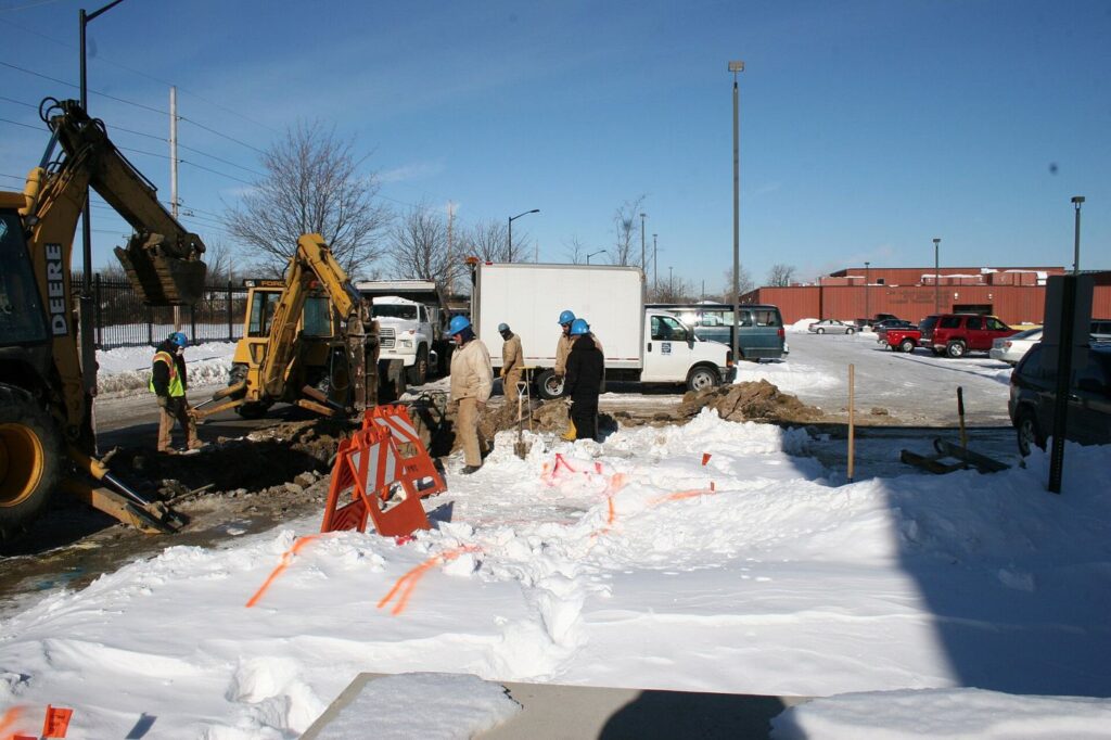 workers upgrading underground water pipes