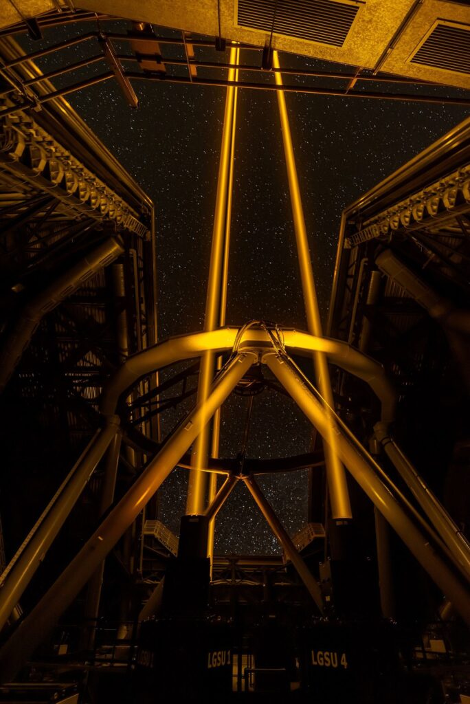 Large telescope structure inside an observatory at night